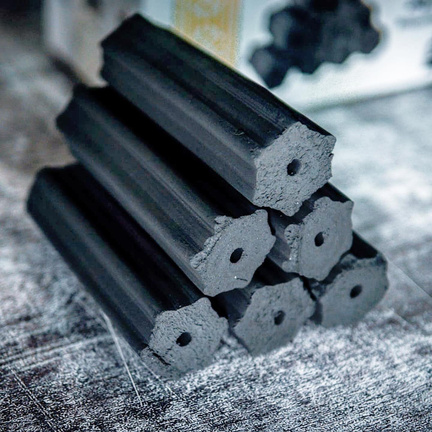Stacked hexagonal coconut charcoal briquette tubes