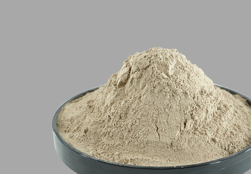 Mound of high alumina refractory brick powder in a steel bowl